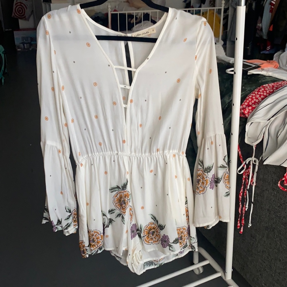 Cream colored romper with floral detail!